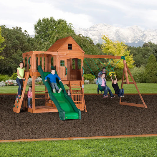Buying a Playset Guide with kids swinging, sliding, and climbing on playset