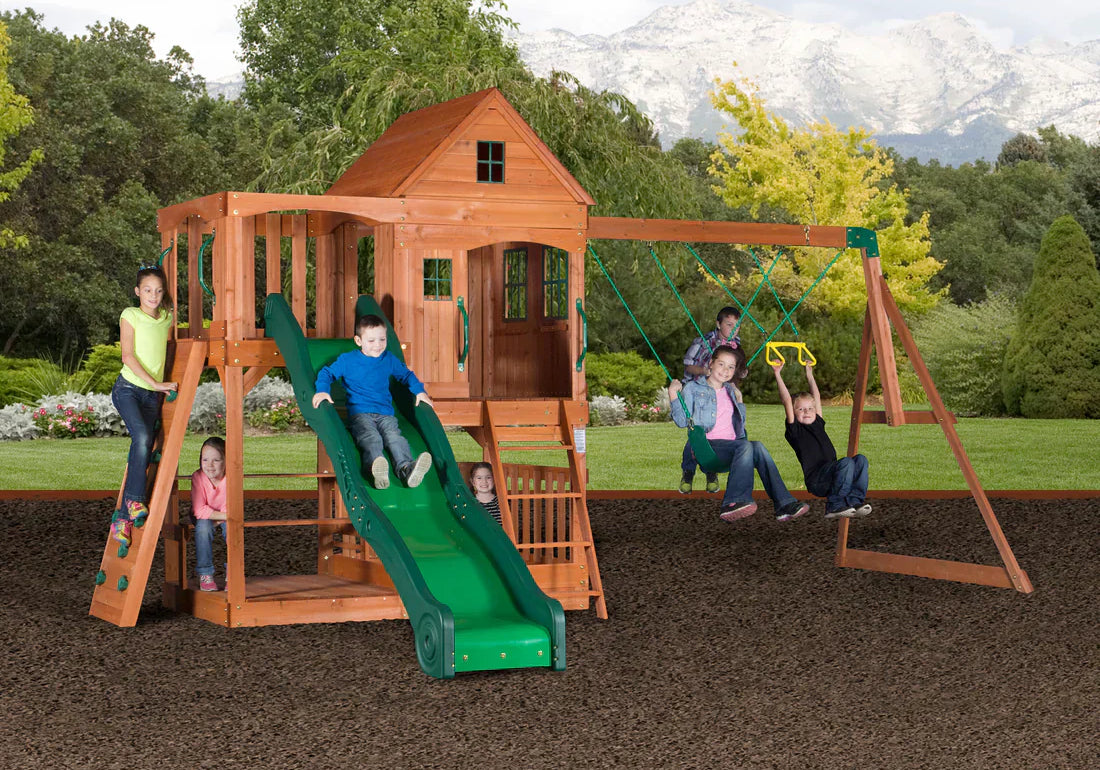 Buying a Playset Guide with kids swinging, sliding, and climbing on playset